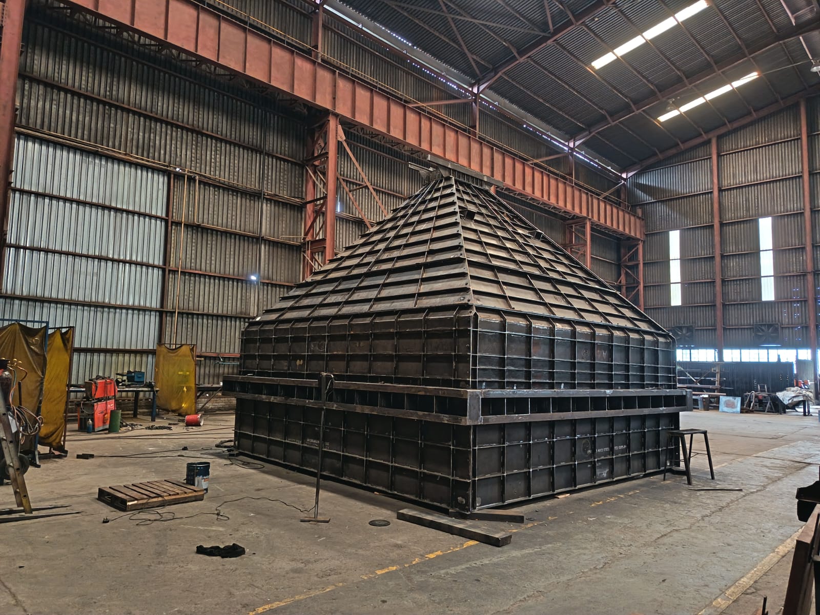 Bulk-material bin fabricated in transportable panels